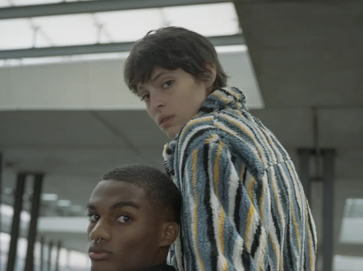 Two models back to back, striped textured jacket